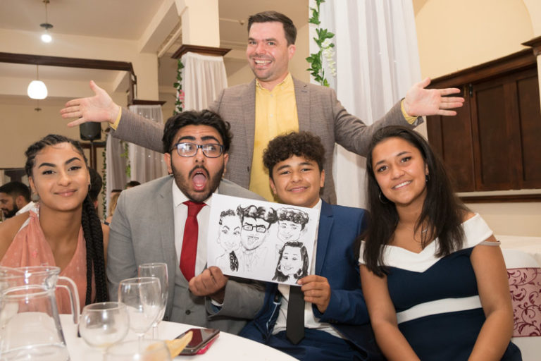 family caricature at a wedding event by caricaturist for hire pen jones