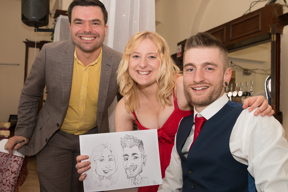 Caricature of a happy couple at a wedding drawn by Caricaturist Pen Jones