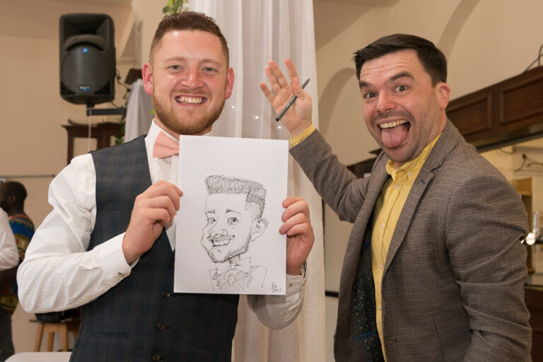 Birmingham, UK Caricaturist for hire pen jones cartoons with a happy customer